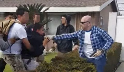 Cop pulls gun on teen in Anaheim, California (Photo Source: YouTube Screen shot)
