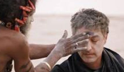 CNN host Reza Aslan eats human flesh with guru (Image Source: Screen Shot CNN “Believers”)