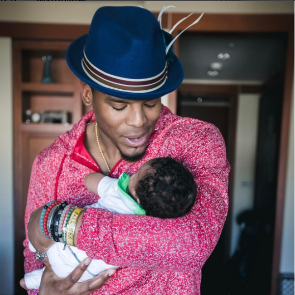 Cam Newton holds his newborn daughter, Sovereign-Dior Cambella Newton (Photo Source: Instagram/Cameron1Newton)