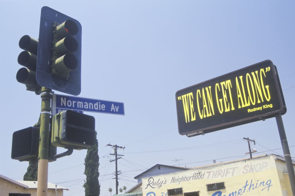 Circa 1992- Billboard reading "we can get along", South Central Los Angeles, California Photo credit: Joseph Sohm/Shutterstock.com