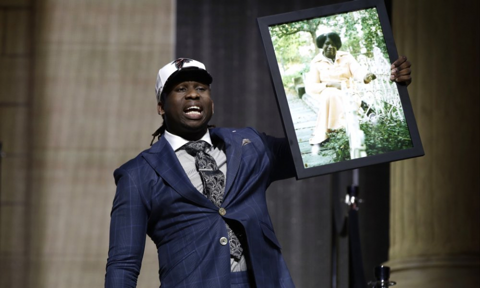 (Photo from @Takk/Twitter) Atlanta Falcons first round pick Takkarist McKinley holds up a frame of his late grandmother.