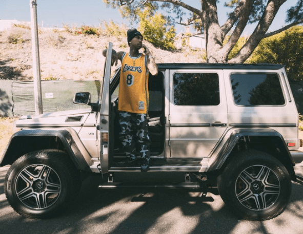 Tyga Rocks A Camouflage Louis Vuitton Jacket While Gassing Up His G-Wagon  On The Sunset Strip 