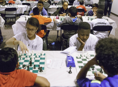 Young Detroit chess players compete against international master