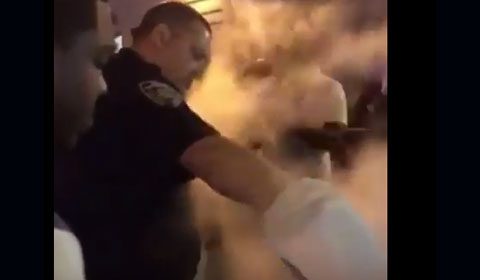 NYPD cop pours water on barbecue grill in front of hungry kids (video)