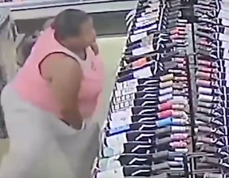 Woman steals 18 bottles of liquor in minutes (video)