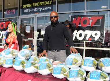 The Super Lawyer and Lovely Mimi unite to hand out 500 turkeys at DK Suit City
