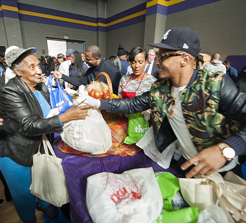 T.I., Keisha Lance Bottoms, Kasim Reed give back during the holiday season