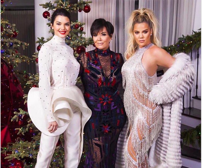 Pregnant Khloe and Kylie finally appear at Kim Kardashian's Christmas party