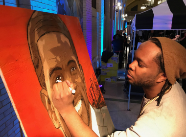 Minneapolis artist Reggie LeFlore paints Mayor Melvin Carter