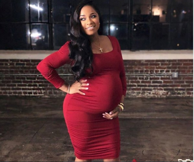 Toya Wright shows baby bump, reveals baby's name