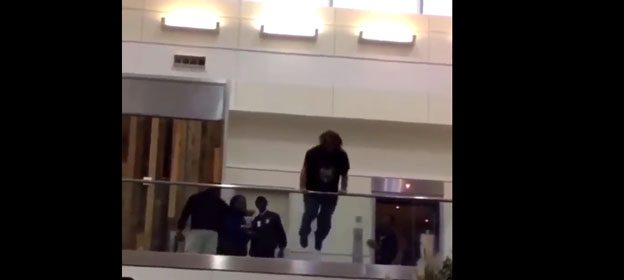 Shock as drunk man at Atlanta airport jumps from balcony (graphic)