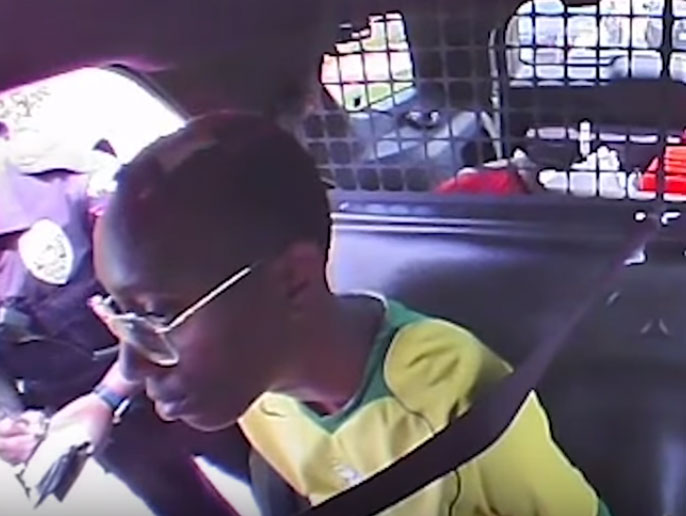 Police detain Black teen for riding with his White grandmother (video)