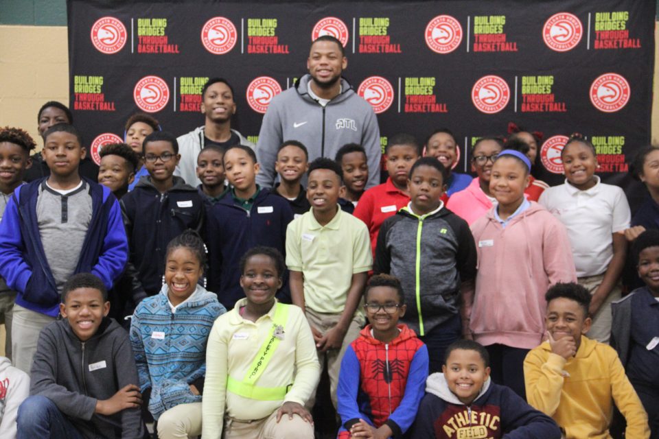 Hawks' Omari Spellman inspires kids to find their voice through poetry