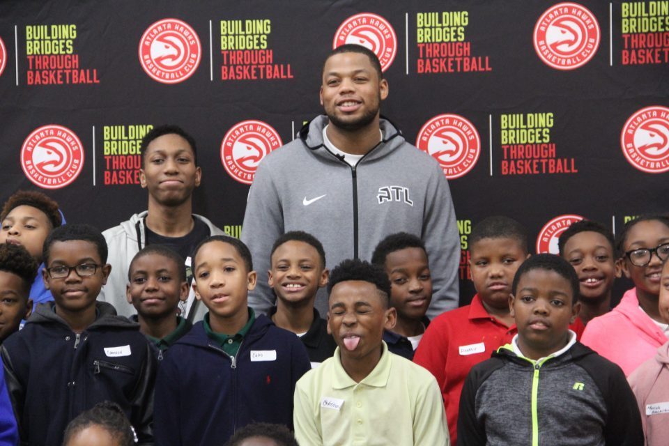 Hawks' Omari Spellman inspires kids to find their voice through poetry