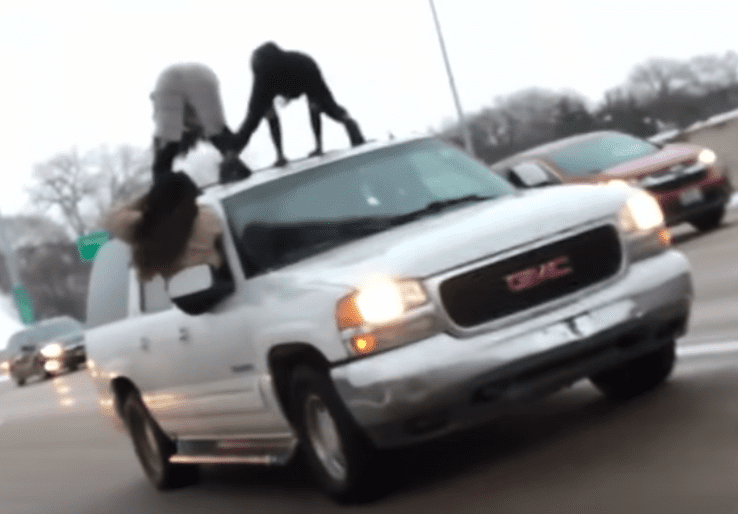 Women caught twerking on top of SUV as it drove on a busy highway