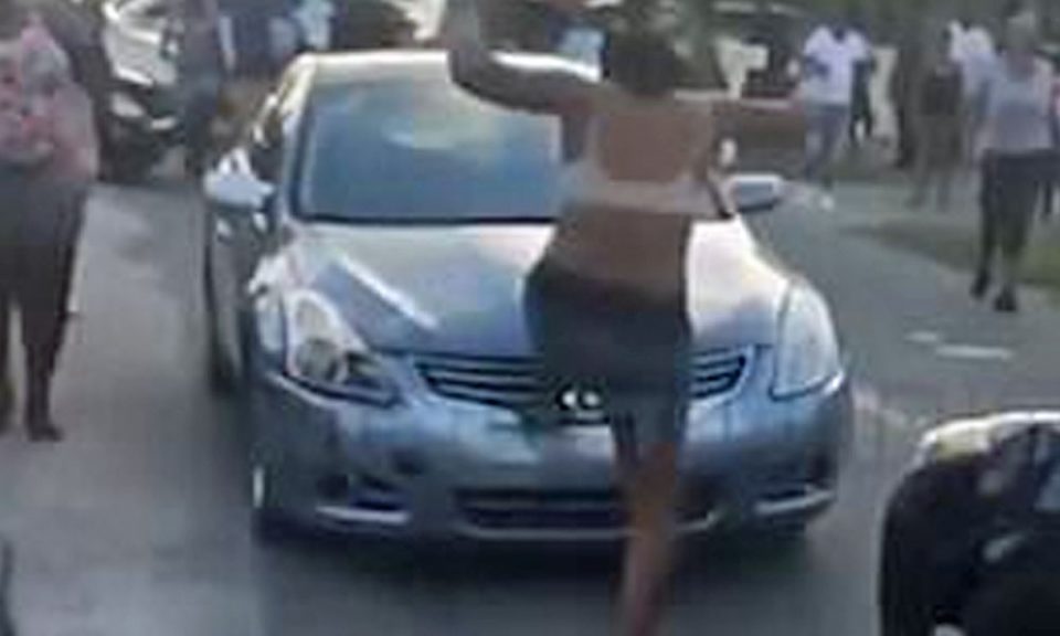Crowd reacts as road rage leads to horrific injury for angry woman (video)