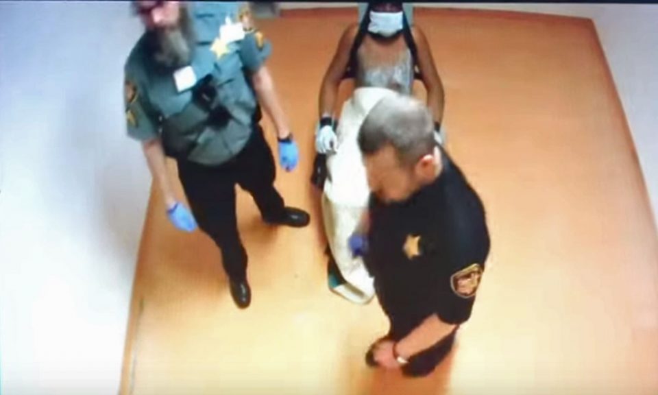 Jail guards charged after brutal assault on restrained inmate (video)