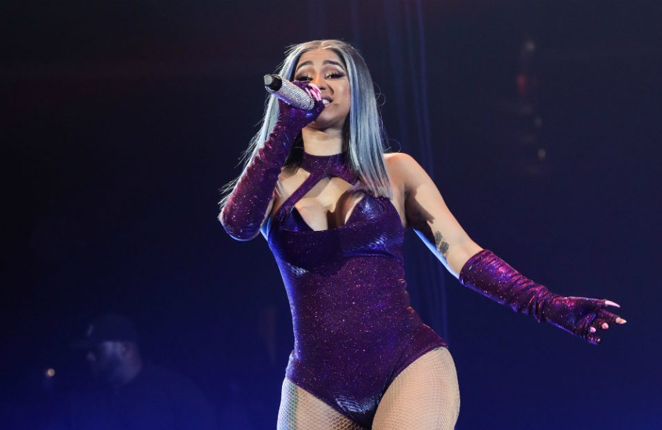 Cardi B shows off before and after photos of her revamped peacock tattoo