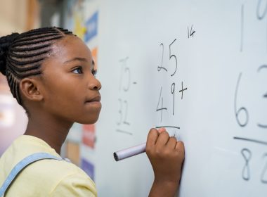 young black student doing math problem