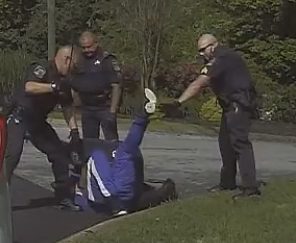 Black man beaten by cops for walking on wrong side of the road (video)