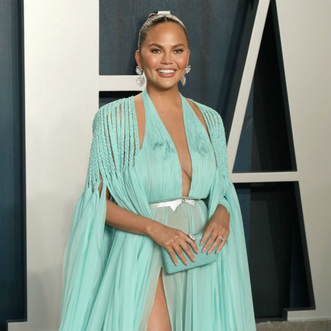 Pregnant star Chrissy Teigen updates fans about baby's condition from hospital