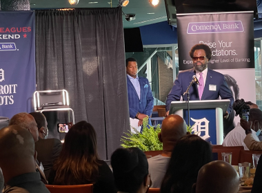 Comerica Bank SVP Irv Ashford Jr. throws first pitch during the Negro Leagues Weekend game in Detroit