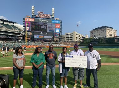 Comerica Bank SVP Irv Ashford Jr. throws first pitch during the Negro Leagues Weekend game in Detroit