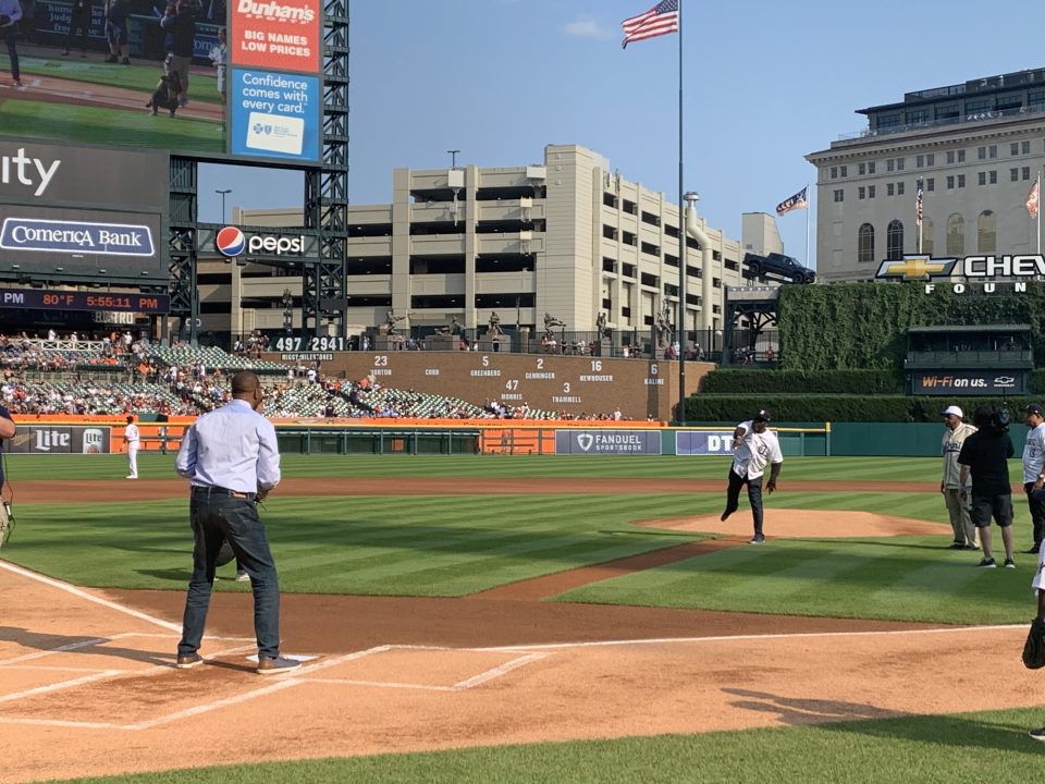 Comerica Bank SVP Irv Ashford Jr. throws first pitch during the Negro Leagues Weekend game in Detroit