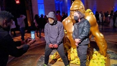 The “First Congress of The Sapien Tribe” gala and charity event was held during the recent NFT NYC tech conference.  Among the items on-site was the NFT (non-fungible token) of the Harambe statue on Wall Street that attendees are shown posing with here. (Lisa Chau)