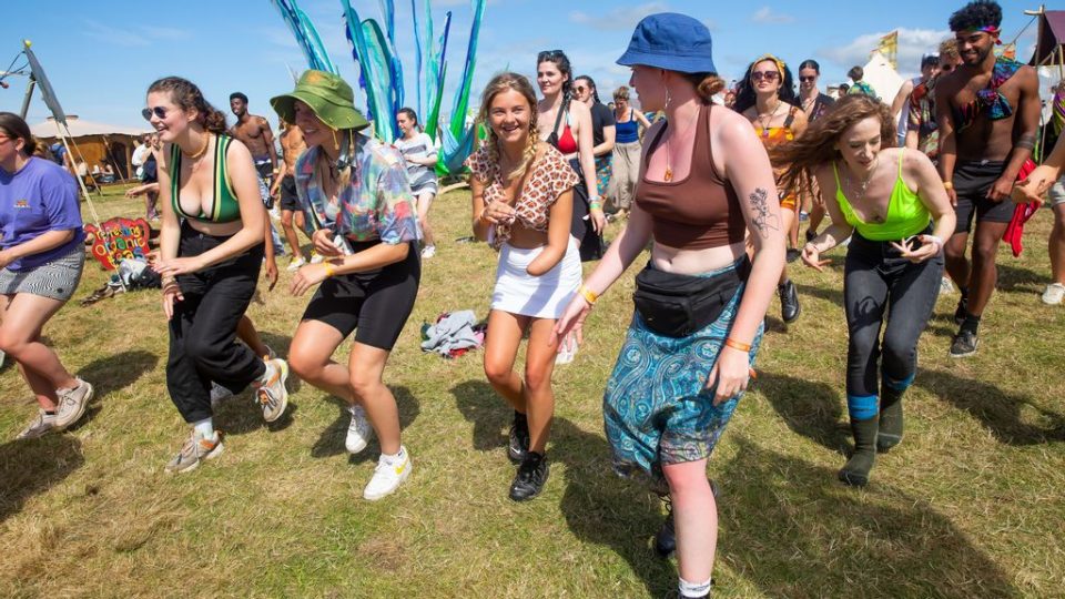 Festival-goers dancing at the hip-hop yoga class during Boardmasters Festival 2021 at Watergate Bay on August 14, 2021 in Newquay, England. (Photo by Jonny Weeks/Getty Images)