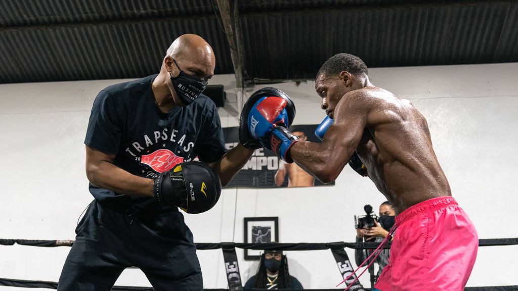 “Errol never went to formal therapy — boxing was therapy, and I was his therapist,” said trainer Derrick James (left) of Errol Spence (right), who was gravely injured in a car accident in October 2019. (Premier Boxing Champions)