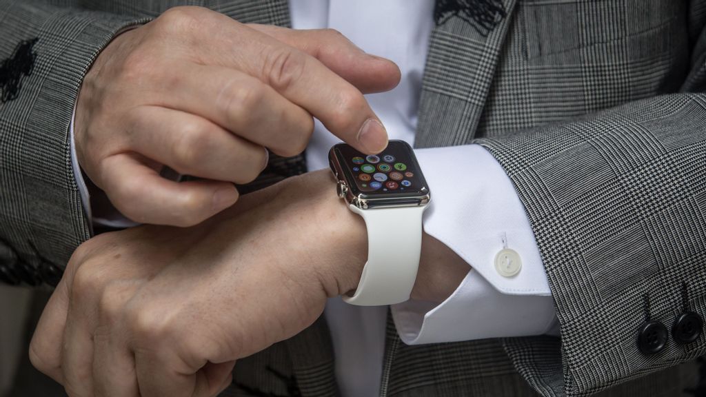Hajime Shimada shows off his newly purchased Apple Watch outside boutique store, Dover Street Market Ginza on April 24, 2015 in Tokyo, Japan. The Apple Watch launched globally today after months of publicity and pre-orders. However the smart watch was not sold from Apple stores but from a handful of upscale boutiques at select locations around the world in a bid to position the watch as a fashion accessory. Apple has been directing people to order online preventing the long lines usual seen with the launch of iPhones and iPads. (Photo by Chris McGrath/Getty Images)