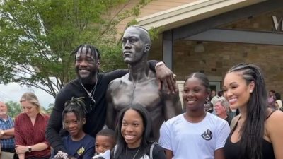 “I’ve invested wisely. ... I don’t have to ever get into the ring again for the rest of my life,” said former heavyweight champion Deontay Wilder (far left) with his family on May 25 for the unveiling of a 7-foot, 830-pound replica statue on the campus of the Tuscaloosa Tourism and Sports building.(Courtesy of Deontay Wilder)