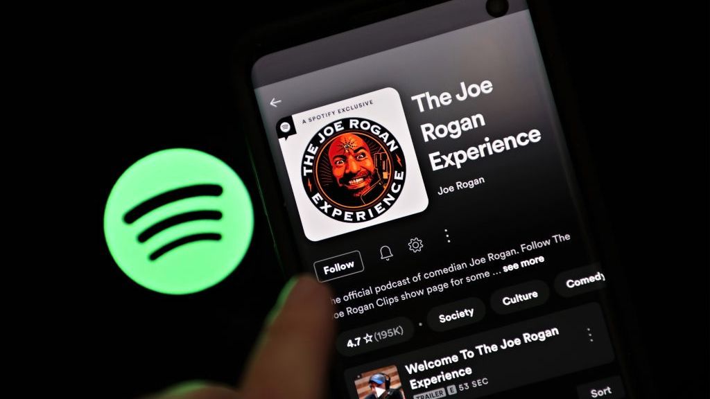 In this photo illustration, The Joe Rogan Experience podcast is viewed on Spotify's mobile app on January 31, 2022 in New York City. (Photo Illustration by Cindy Ord/Getty Images)