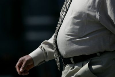 A man walks along the Embarcadero April 6, 2005 in San Francisco. According to a study released Tuesday, almost 53 percent of Californians over 25 are overweight, and more than 17 percent are obese, or extremely overweight and are costing nearly $21.7 billion a year in medical bills, injuries and lost productivity. (Photo by Justin Sullivan/Getty Images)