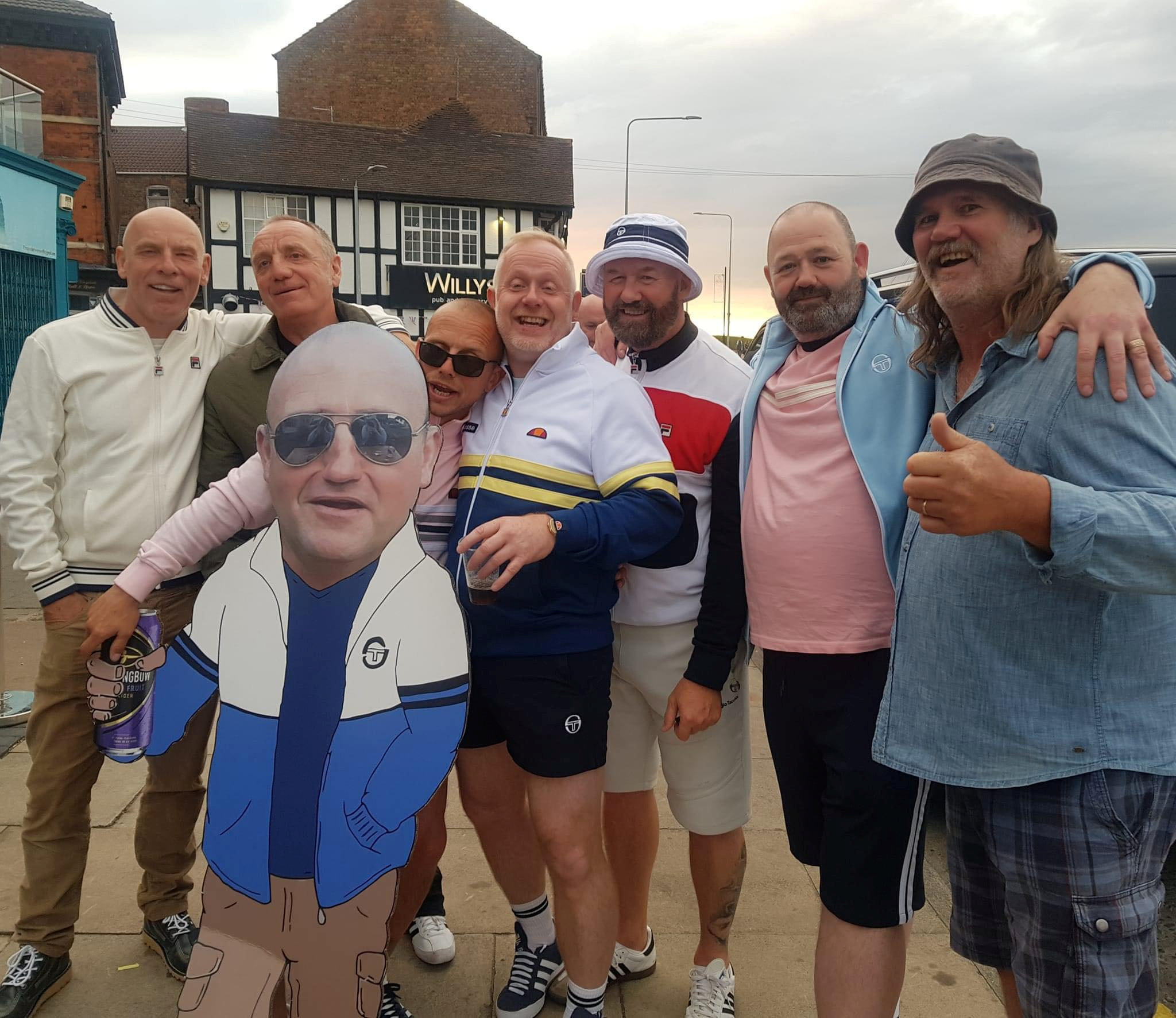 A group of 40 friends gathered from around the world to go on a night out with a cardboard cut-out of their beloved pal who sadly lost his battle with cancer. (Matthew Newby SWNS/Zenger)