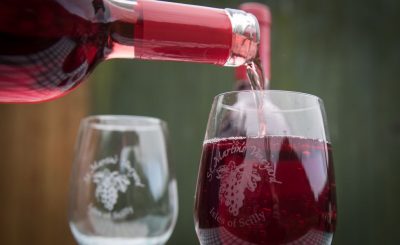 Valerie Thomas of St Martin's Vineyard, the most south-westerly vineyard in England, pours a glass of wine produced on her farm on St Martin's on the Isles of Scilly on February 18, 2017 in Isles of Scilly, England.(Photo by Matt Cardy/Getty Images)