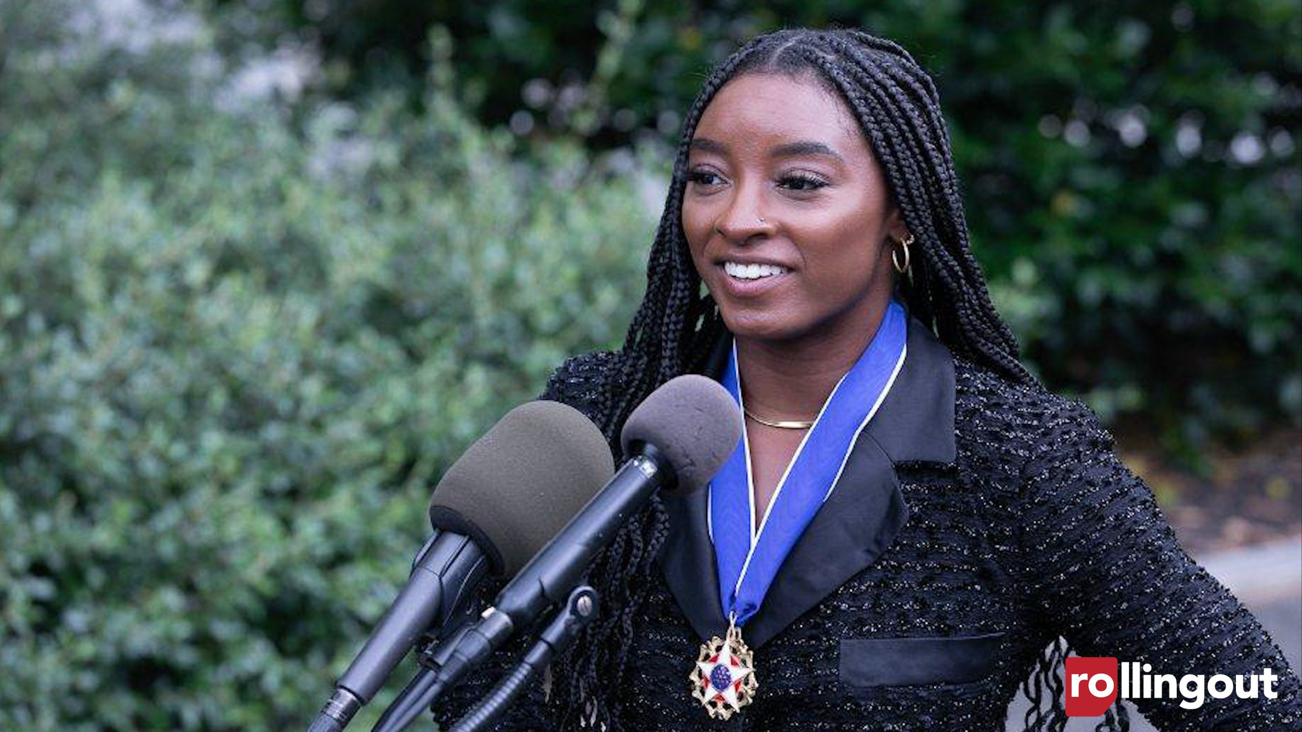 Simone Biles speaks outside the White House after receiving the Presidential Medal of Freedom. (Photo credit: Mark Mahoney for rolling out)