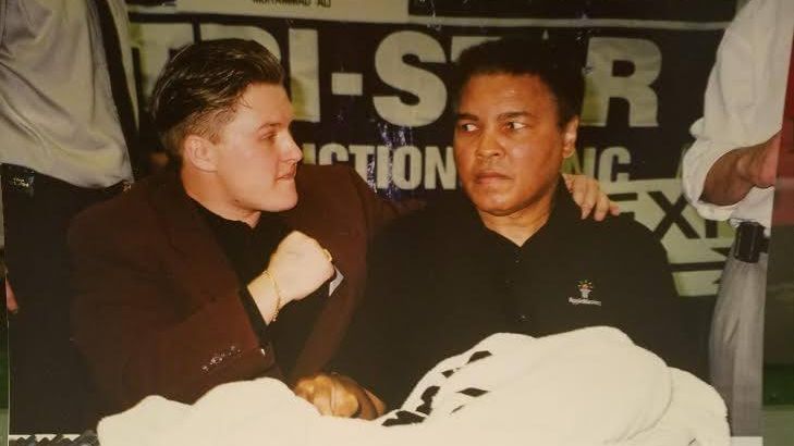 Mears Online Auctions CEO, Troy Kinunen with Muhammad Ali during an autograph signing. (Troy Kinunen) 
