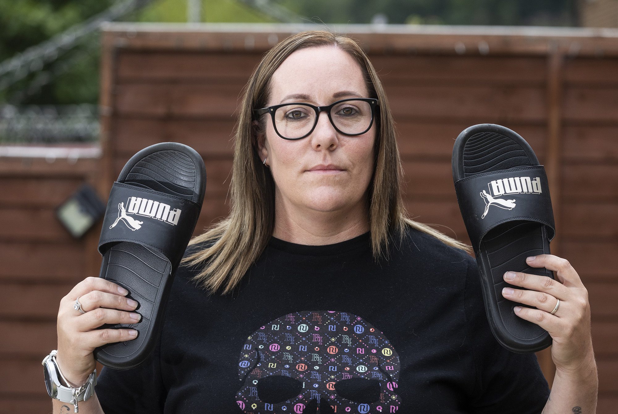 Kerry Tattersley has revealed how a $36 pair of Puma sliders saved her life after she was electrocuted while vacuuming her astroturf, pictured at her home in Halifax, England. Undated photo. (Lee McLean,SWNS/Zenger)