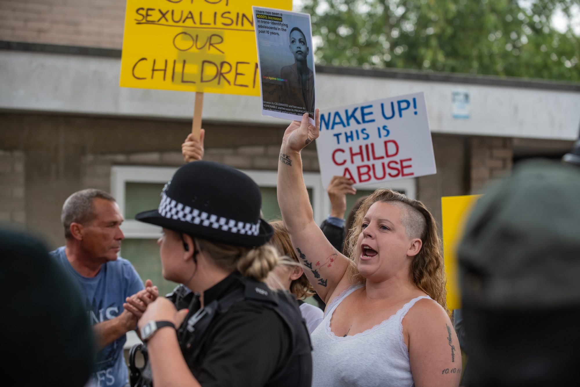 Protestors try to perform a citizen's arrest on a Drag performer from Drag Queen Story Hour UK at Henleaze Library, Bristol, July 28 2022. (Adam Hughes, SWNS/Zenger)