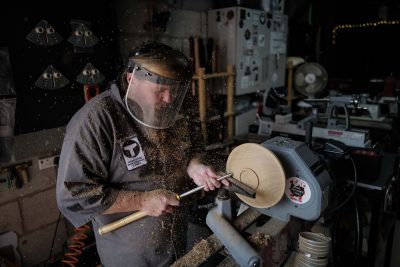 Chris Fisher, of Ashbourne, Derbyshire, Britain's first completely blind wood turner, July 27 2022. Fisher carves intricate items and works of art out of lumps of wood despite being blind - using his senses of touch and smell. (SWNS/Zenger)