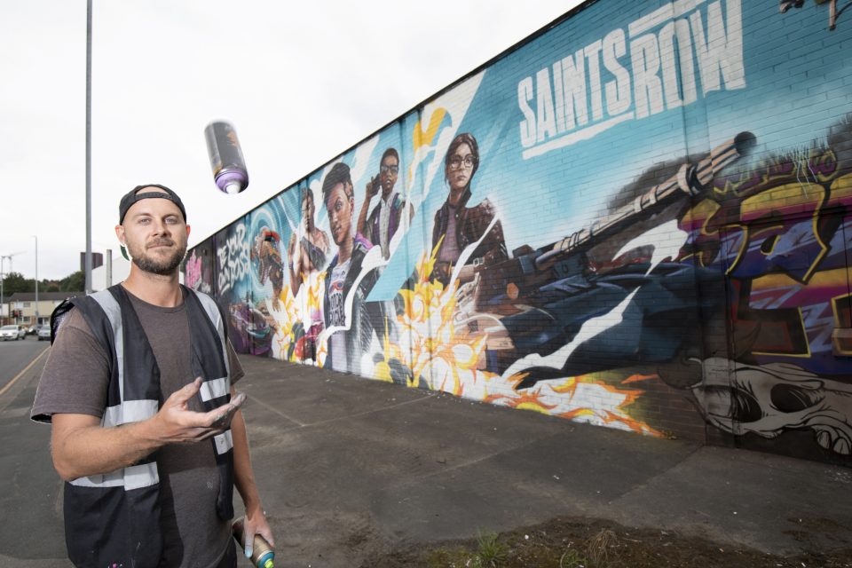 A Saints Row mural is unveiled in Leeds, to celebrate the city being crowned home of the U.K.'s most ambitious self-made under 30's, the boss factory. The research was commissioned by PLAION, to launch the video game 'Saints Row', on August 23, where a group of young friends embark on their own criminal venture, as they rise to the top in their bid to become self-made. (Pinpep,Plaion,SWNS/Zenger)