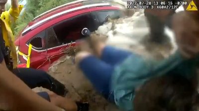 Rescue of a motorist stranded in their car during a flood, on Thursday, July 28, 2022, in Apache Junction, Arizona, USA. They were unable to retrieve her dog from the water.  (@ApacheJunctionPD/Zenger)