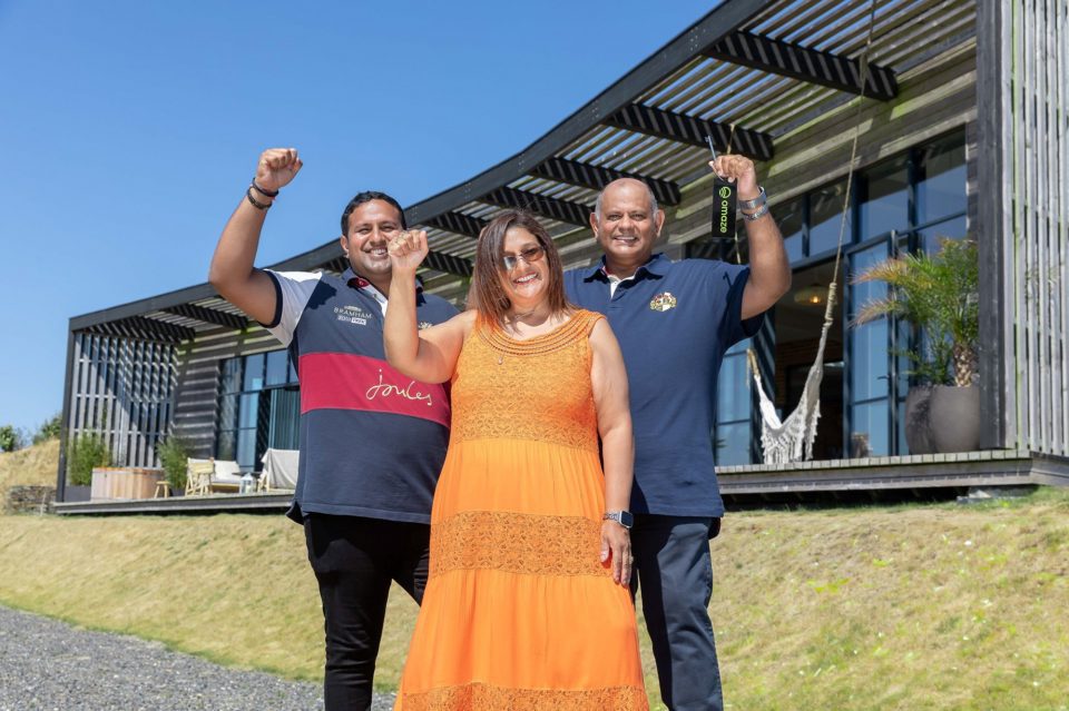 Uttam Parmar with wife Raki and son Aaron pose in an undated photograph. Uttam has scooped an award-winning $3.64 million four-bedroom house in the region of Cornwall, in the United Kingdom. (Omaze,SWNS/Zenger)