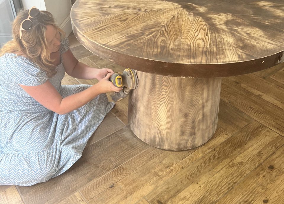 Louise Jones doing DIY table refurbishing in an undated photo. Louise Jones managed to save $36k by renovating her home from scratch - to showroom standard - using Facebook Marketplace, car boots and DIY. (Louise Jones, SWNS/Zenger)