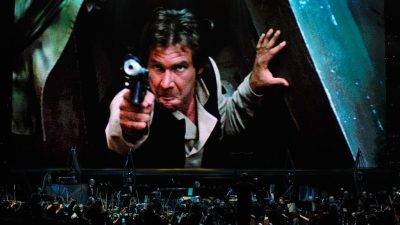 Actor Harrison Ford's Han Solo character from Star Wars Episode VI: Return of the Jedi is shown on screen while musicians perform during Star Wars: In Concert at the Orleans Arena on May 29, 2010 in Las Vegas. (Photo by Ethan Miller/Getty Images)