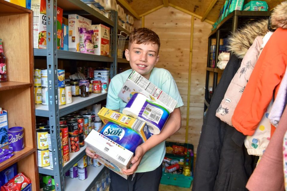 Isaac Winfield, 11, has set up his own food bank at his home. (Photo by Emma Trimble via SWNS)