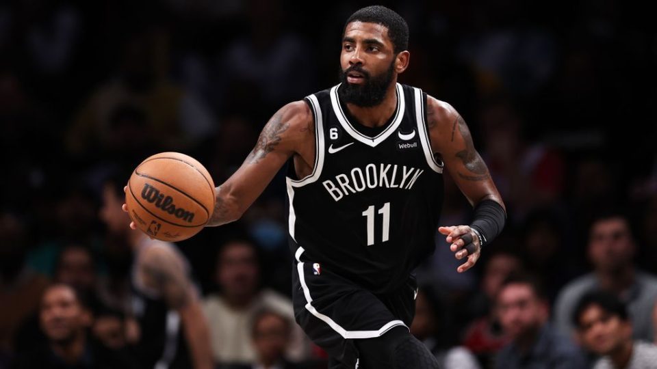 Kyrie Irving, No. 11 of the Brooklyn Nets, brings the ball up the court during the fourth quarter of the game against the Chicago Bulls at Barclays Center on Nov. 1. After being suspended for antisemitic remarks on Nov. 3, and eventually apologizing, Irving played in the game against the Memphis Grizzlies on Nov. 20. DUSTIN SATLOFF/GETTY IMAGES 