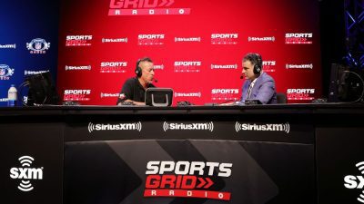 (L-R) SiriusXM host Scott Ferrall and sports analyst Darren Rovell speak during an interview on day 2 of SiriusXM at Super Bowl LVI on February 10, 2022 in Los Angeles, California. Darren Rovell stated the value of having sports rights for competitions that need to be watched live. CINDY ORD/BENZINGA